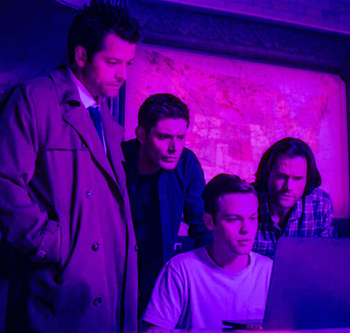 meow a screenshot of castiel, dean winchester, sam winchester, and jack kline all looking at a laptop in front of jack. the image is colored to be lit in neon purple lighting.